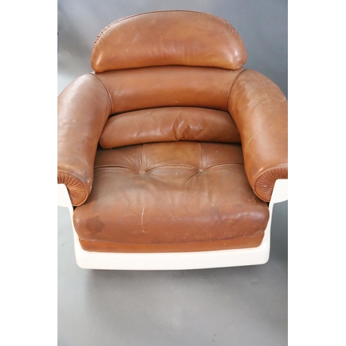 378 - A pair of mid century tan leather and fibreglass tub chairs, possibly French, by Airbourne, W.3ft 1i... 