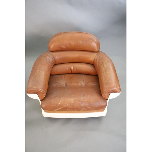 378 - A pair of mid century tan leather and fibreglass tub chairs, possibly French, by Airbourne, W.3ft 1i... 