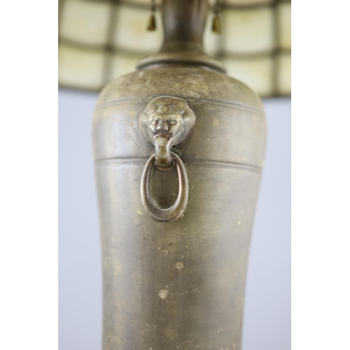 38 - An early 20th century Tiffany style bronze table lamp, by Handel, with opaque leaded glass domed sha... 