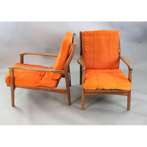 383 - A pair of mid century Danish teak armchairs, with original burnt orange fabric upholstery, W.2ft 2.5... 