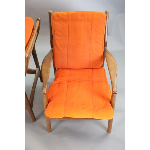 383 - A pair of mid century Danish teak armchairs, with original burnt orange fabric upholstery, W.2ft 2.5... 