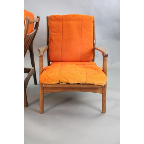 383 - A pair of mid century Danish teak armchairs, with original burnt orange fabric upholstery, W.2ft 2.5... 