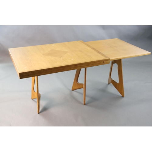 384 - A Guillerme & Chambron golden oak draw leaf dining table, with extending rectangular top on stylised... 