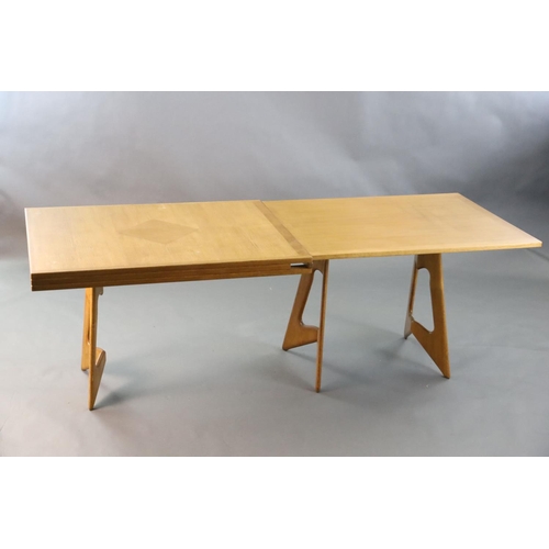 384 - A Guillerme & Chambron golden oak draw leaf dining table, with extending rectangular top on stylised... 