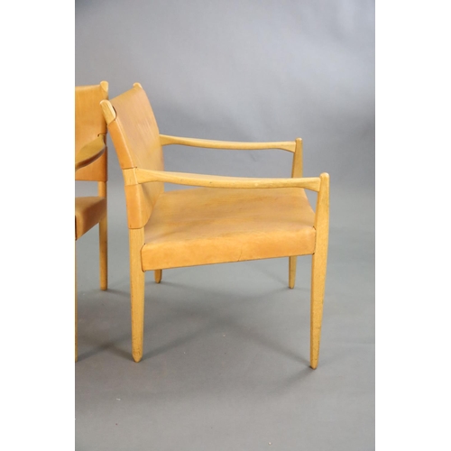 385 - A pair of Swedish Varufakta tan leather and golden oak armchairs, W.2ft 1in. D. 2ft 1in. H.2ft 4in.C... 