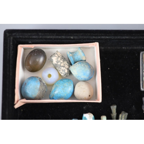 4 - A group of Egyptian stone and turquoise glazed faience amulets, beads and fragments, late Kingdom to... 