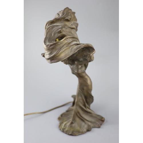 40 - After Raoul Larche (1860-1912). A bronze 'Loie Fuller' table lamp the dancer with raised arms, weari... 