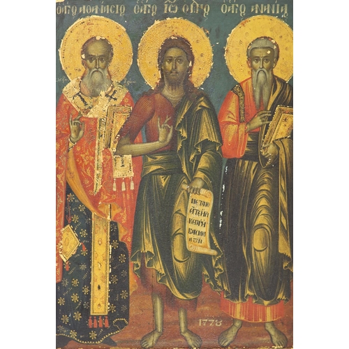 415 - An 18th century Macedonian tempera on panel icon, depicting Saints Athanasius, John the Baptist and ... 