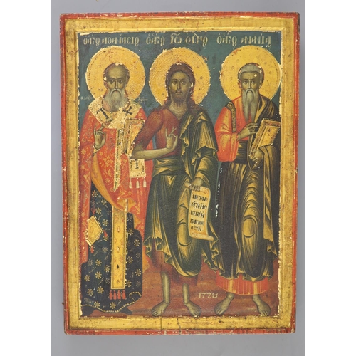 415 - An 18th century Macedonian tempera on panel icon, depicting Saints Athanasius, John the Baptist and ... 