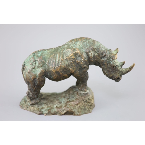 42 - § Hamish Mackie (1973-). A bronze model of a rhinoceros, standing upon a naturalistic base, incised ... 