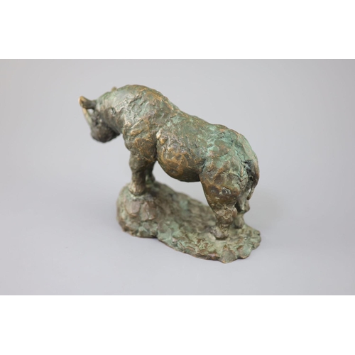 42 - § Hamish Mackie (1973-). A bronze model of a rhinoceros, standing upon a naturalistic base, incised ... 