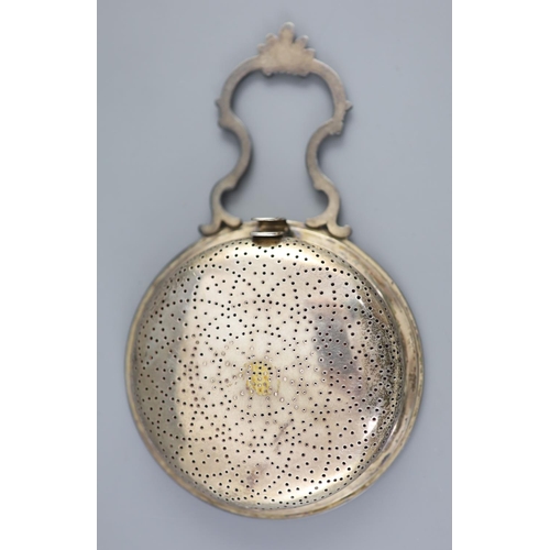 488 - A George III silver single handled lemon strainer, London, 1779, with ornate scroll handle and beade... 