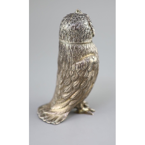 490 - A Victorian silver owl sugar sifter, having chased feather decoration and removable head inset glass... 