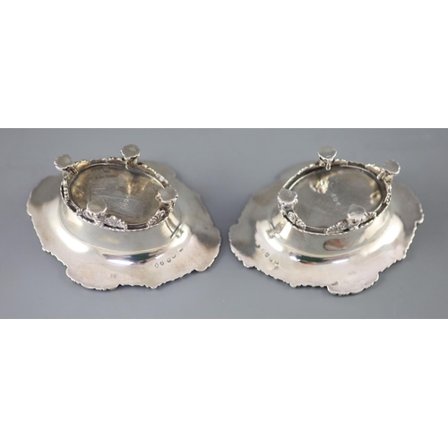 497 - A pair of George III cast silver oval table salts by Paul Storr, with gadrooned and shell borders, o... 