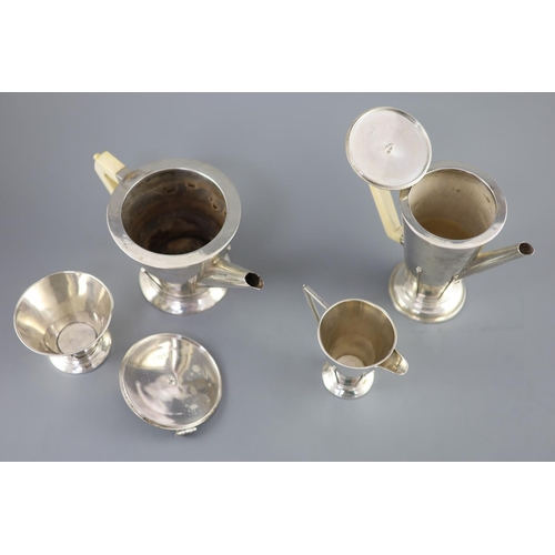 498 - A stylish 1930's Art Deco silver four piece tea and coffee service by Charles Boyton, of conical for... 