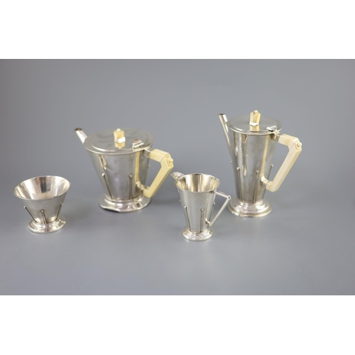 498 - A stylish 1930's Art Deco silver four piece tea and coffee service by Charles Boyton, of conical for... 