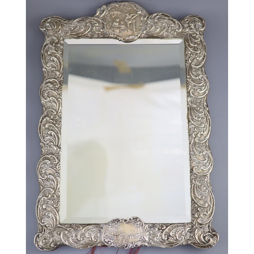 501 - An Edwardian repousse silver mounted toilet mirror, Henry Matthews, Birmingham, circa, 1905, decorat... 