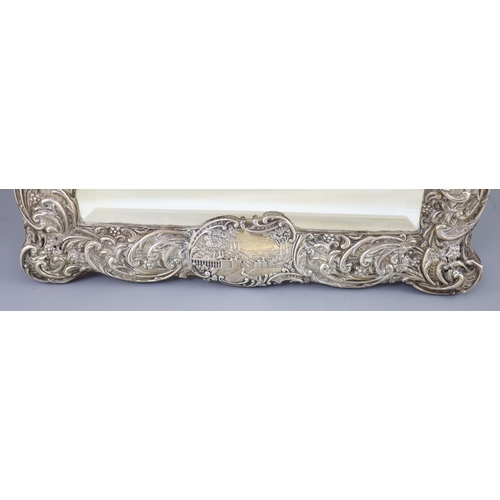 501 - An Edwardian repousse silver mounted toilet mirror, Henry Matthews, Birmingham, circa, 1905, decorat... 