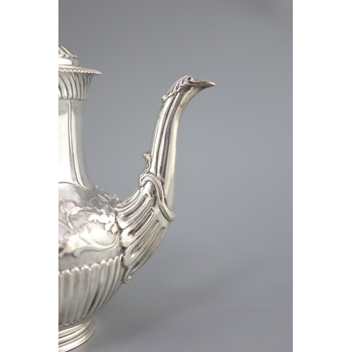 502 - A Victorian silver coffee pot by Richard Sibley II, of baluster form, with acanthus leaf capped hand... 