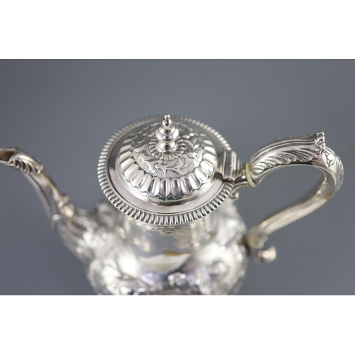 502 - A Victorian silver coffee pot by Richard Sibley II, of baluster form, with acanthus leaf capped hand... 