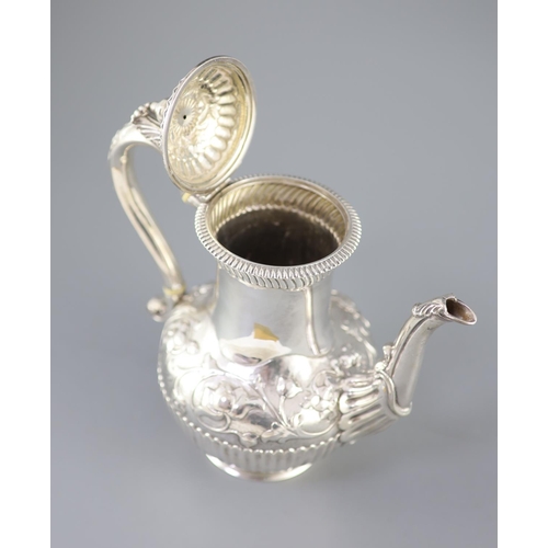 502 - A Victorian silver coffee pot by Richard Sibley II, of baluster form, with acanthus leaf capped hand... 