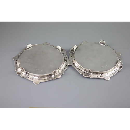 505 - A good pair of George II silver card trays by George Wickes, of shaped circular form, with pierced f... 