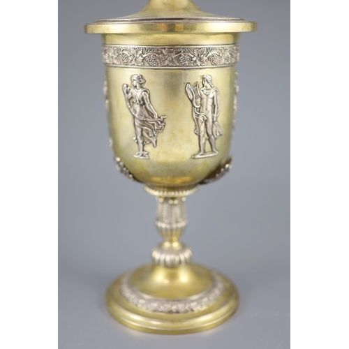 507 - A late 19th/early 20th century German parcel gilt 800 standard presentation pedestal cup and cover, ... 