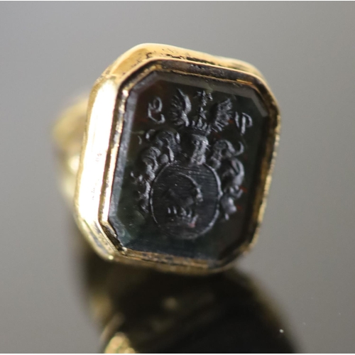 522 - A 19th century gold and black onyx? set fob seal, modelled as a seated monkey with ruby coloured eye... 