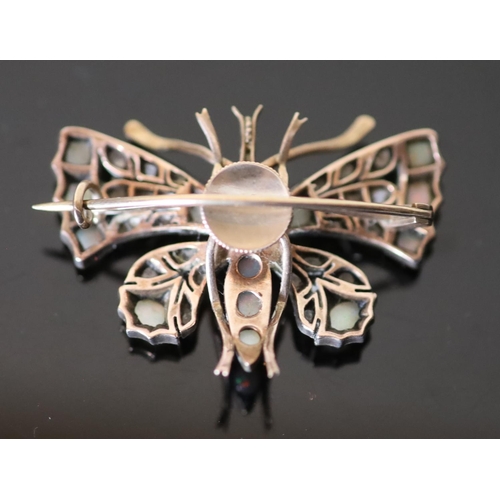 540 - An Edwardian gold and silver, rose cut diamond, white opal and ruby set butterfly brooch, width 43mm... 