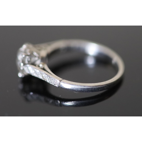 543 - A mid 20th century white gold and single stone diamond ring, with diamond set shoulders, the stone w... 