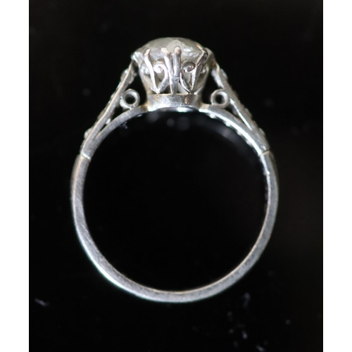 543 - A mid 20th century white gold and single stone diamond ring, with diamond set shoulders, the stone w... 