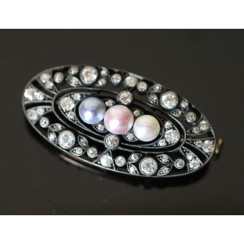 558 - An early 20th century gold and silver, diamond and three colour split pearl set oval openwork brooch... 