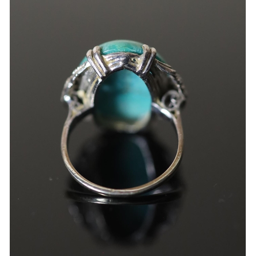 573 - A 20th century 18k white gold, cabochon turquoise and rose cut diamond chip set oval dress ring, siz... 