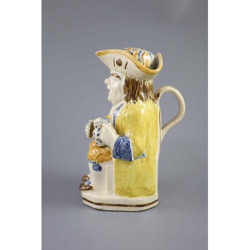 58 - A Staffordshire Prattware 'Good Hearty Fellow' Toby jug with rare hat measure, c.1790-1800, on a can... 