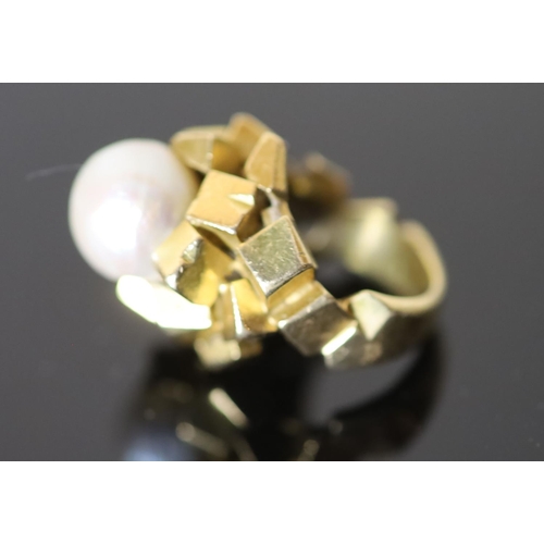 589 - A modern continental 18ct gold (stamped 750) and baroque cultured pearl set modernist dress ring, si... 