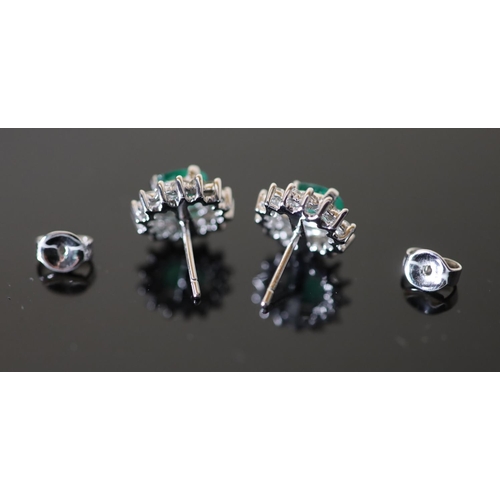 592 - A modern pair of white gold?, emerald and diamond cluster oval earrings, 12mm, gross weight 4.8 gram... 