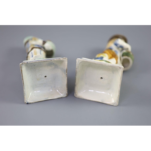 66 - A pair of Prattware figures of fruit and biscuit street vendors, c.1790-1800, on square bases, pearl... 