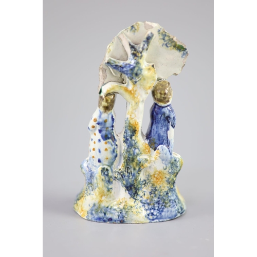 69 - A Staffordshire Prattware 'Toy' group, c.1790-1800, moulded with two figures each side of bocage and... 