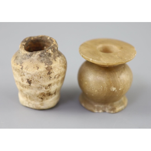 7 - Two Egyptian alabaster cosmetic jars, c.1500 BC and Ptolemaic period (305-30 BC), the older jar with... 