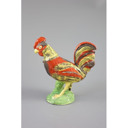 73 - A Staffordshire pearlware figure of a cockerel, c.1820, on a naturalistic mound base, 19cm highCONDI... 