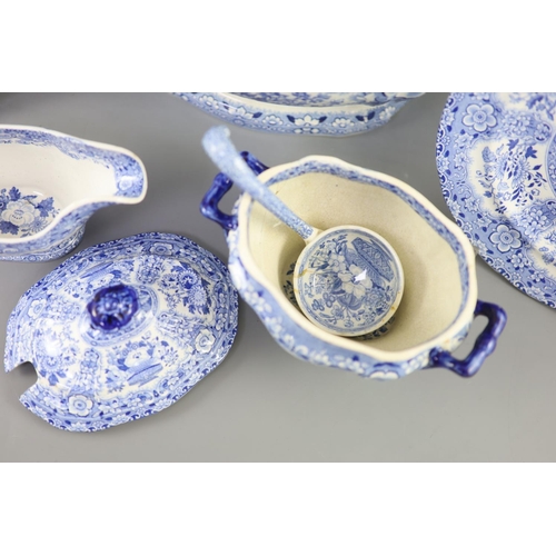 79 - An extensive Minton filigree pattern blue and white dinner service, c.1830, including a soup tureen,... 