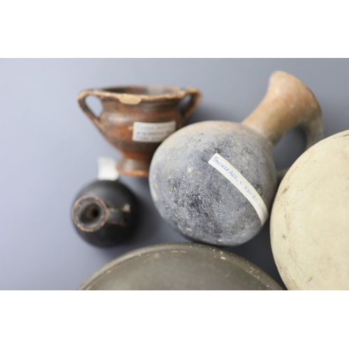 8 - A group of Ancient Greek pottery vessels, Attic and Apulia, 4th-5th century BC, most with old collec... 