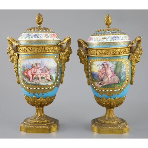 83 - A pair of French Sevres style porcelain and ormolu mounted vases and covers, 19th century, each pain... 