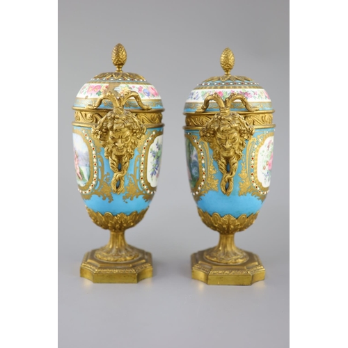 83 - A pair of French Sevres style porcelain and ormolu mounted vases and covers, 19th century, each pain... 