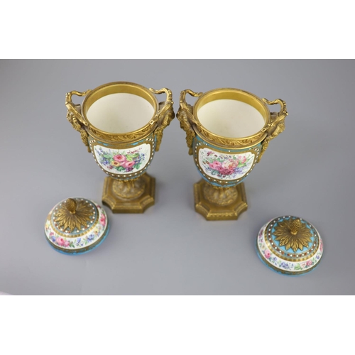 83 - A pair of French Sevres style porcelain and ormolu mounted vases and covers, 19th century, each pain... 