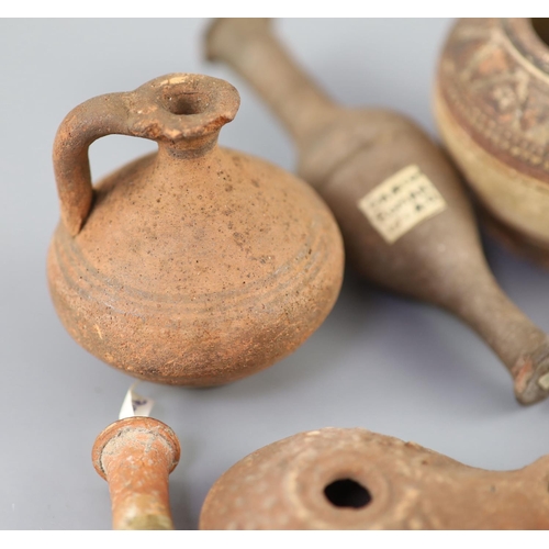 9 - A group of Ancient Roman pottery vessels and a bronze statuette of Venus, mostly 1st-4th century AD,... 