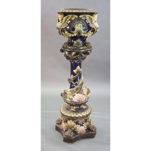 91 - A Continental Palissy style grotesque pottery jardiniere and associated pedestal, late 19th century,... 