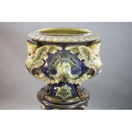 91 - A Continental Palissy style grotesque pottery jardiniere and associated pedestal, late 19th century,... 