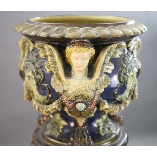 91 - A Continental Palissy style grotesque pottery jardiniere and associated pedestal, late 19th century,... 