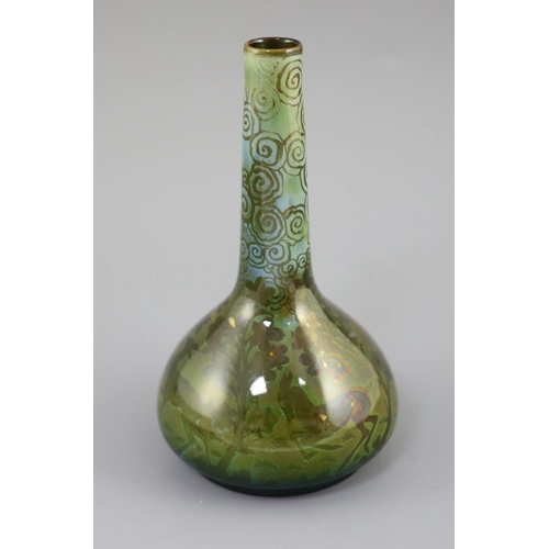 94 - Richard Joyce for Pilkington Royal Lancastrian. A lustre bottle vase, in green, yellow and blue tone... 